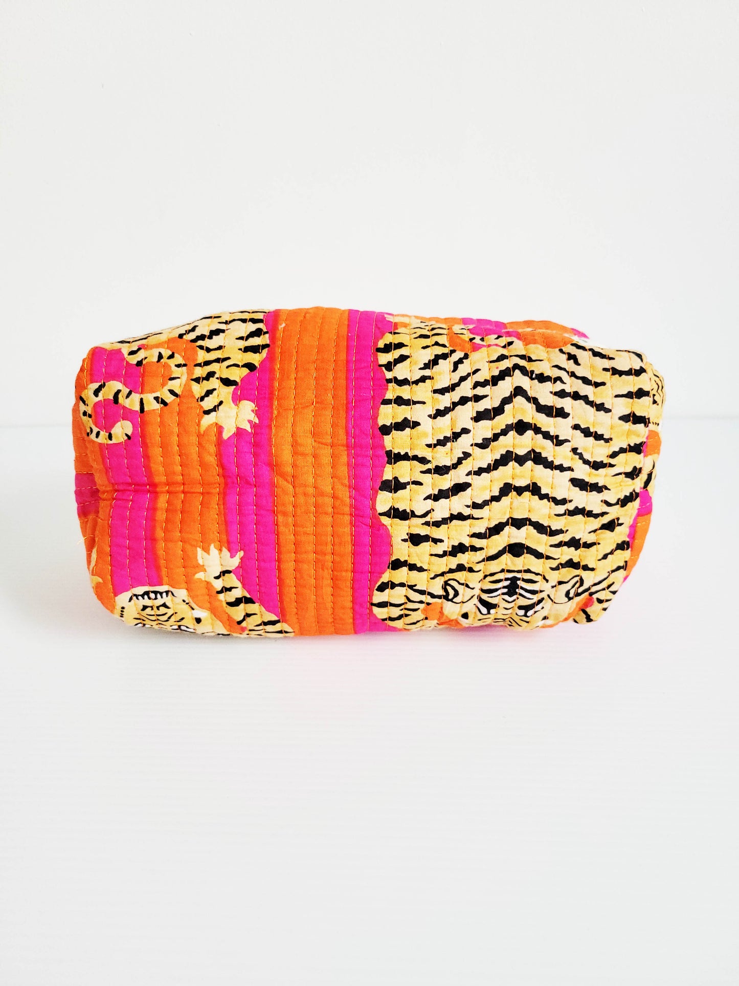 Close-up of orange and pink leopard tote.