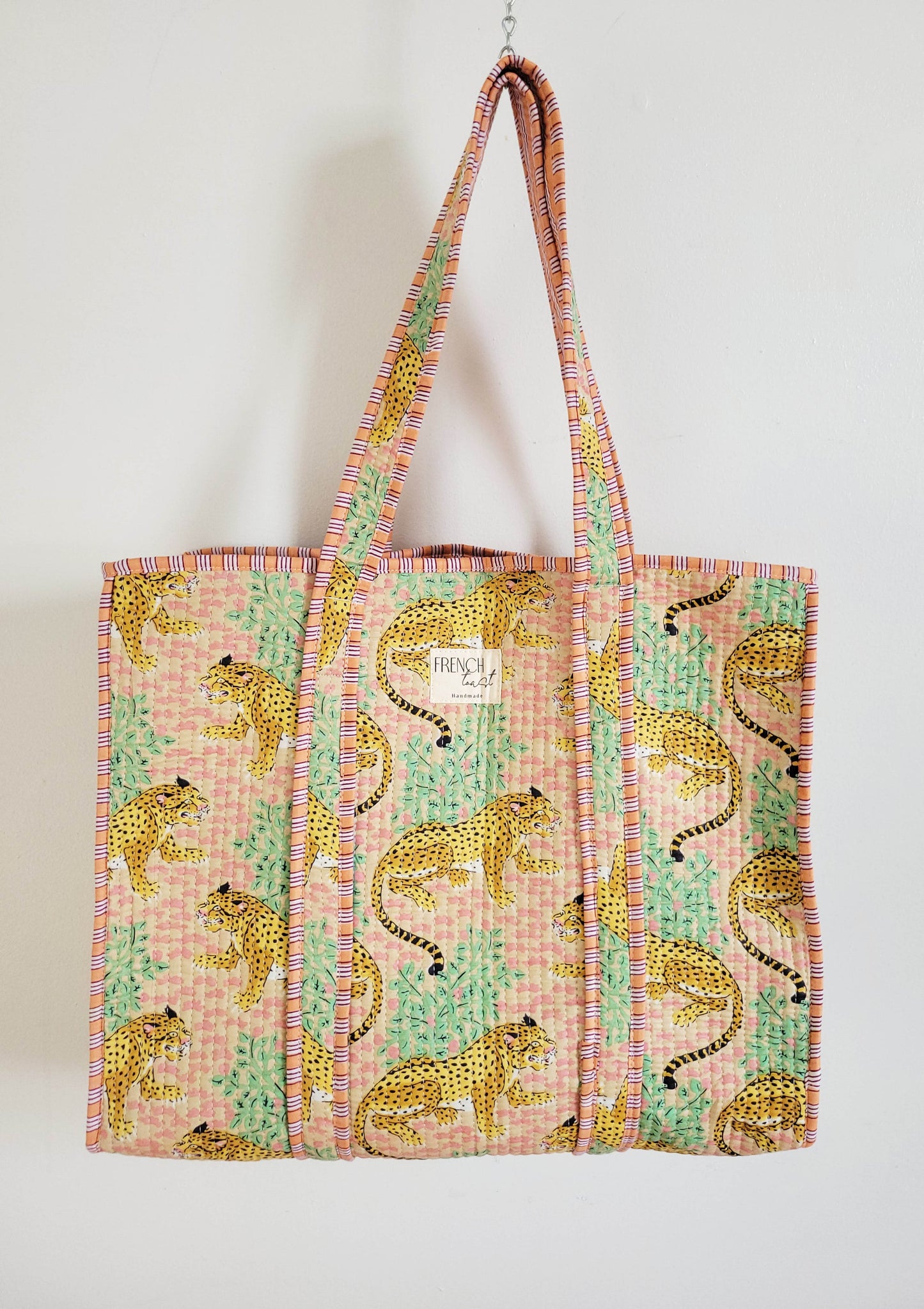 Top view of the white cheetah print tote.