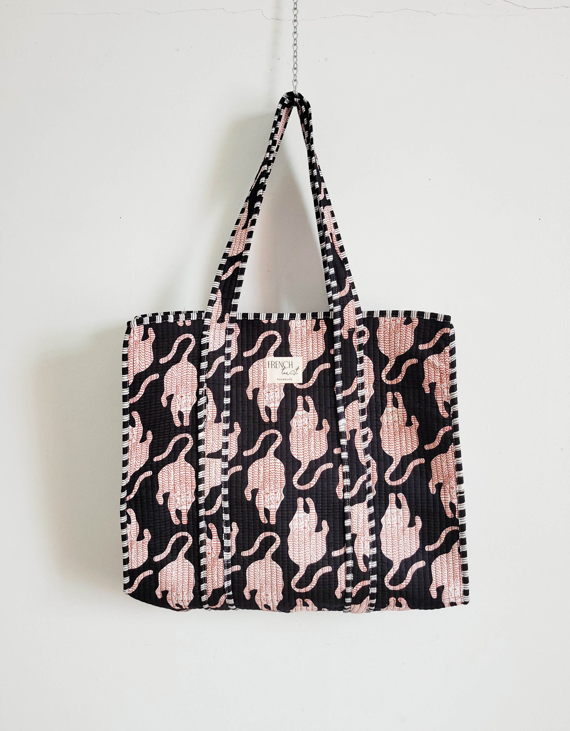 Side view of pink zebra leopard tote.