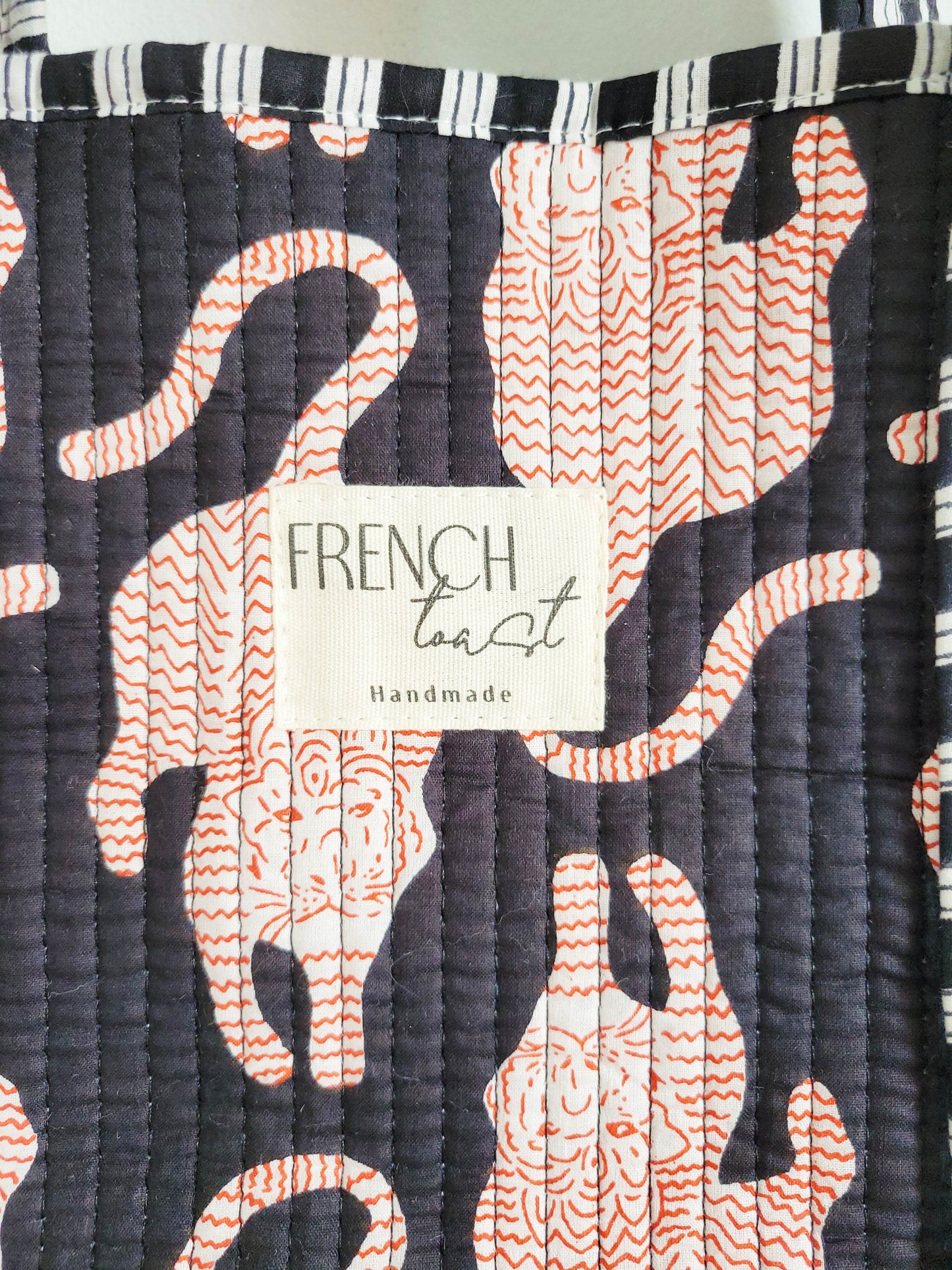 Tote with pink zebra and leopard print details.