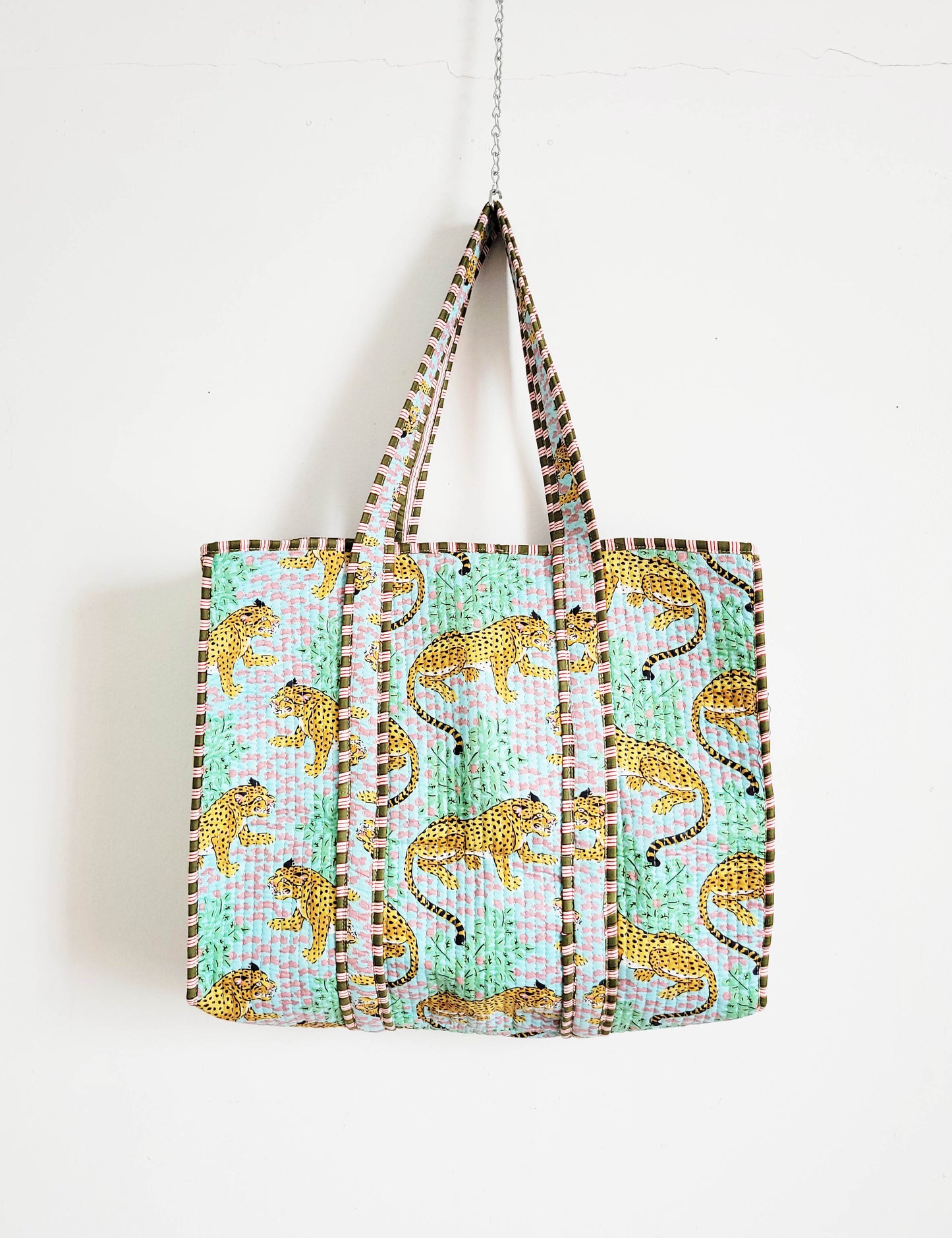 Flat-lay of accessories and clothing on table.