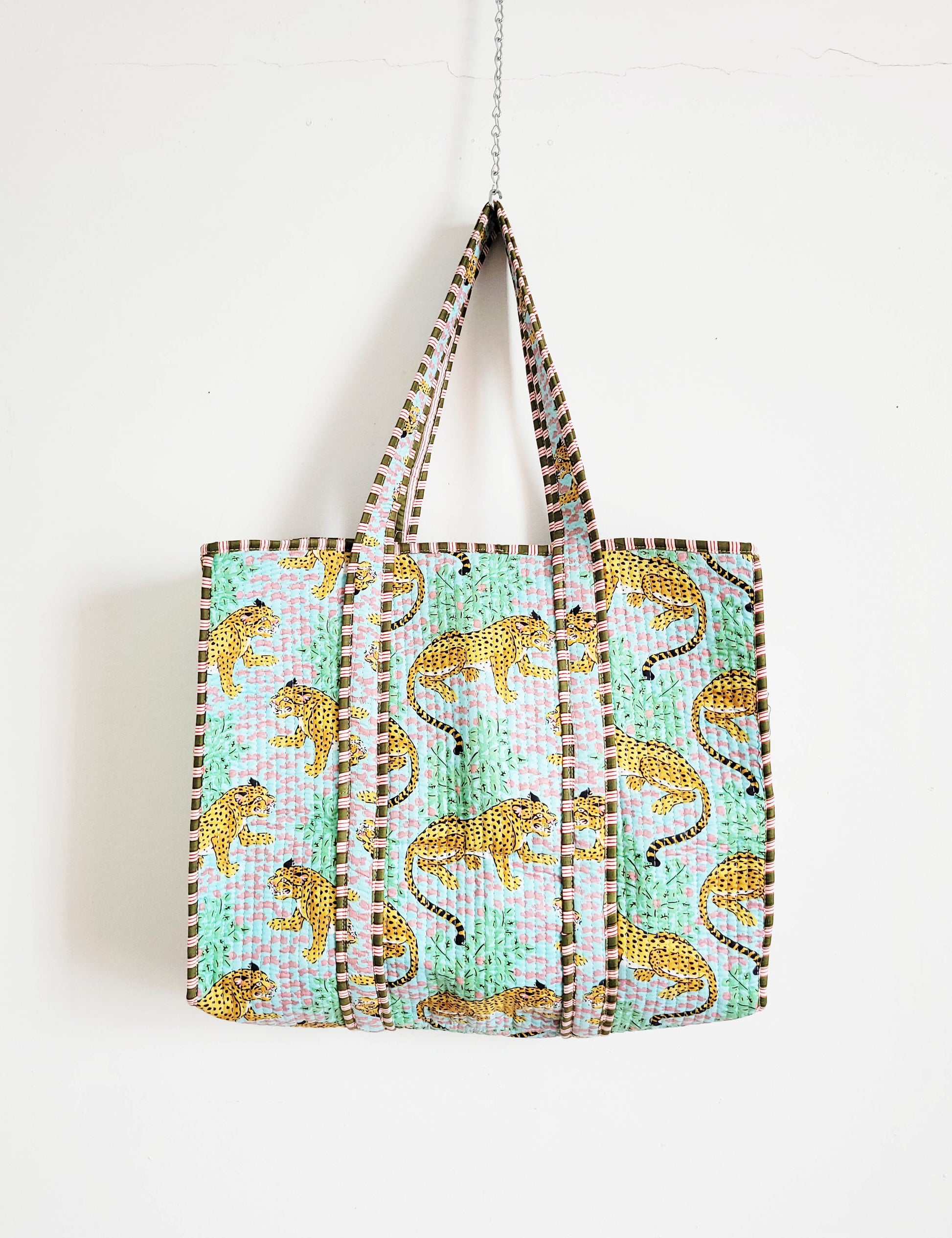 Flat-lay of accessories and clothing on table.