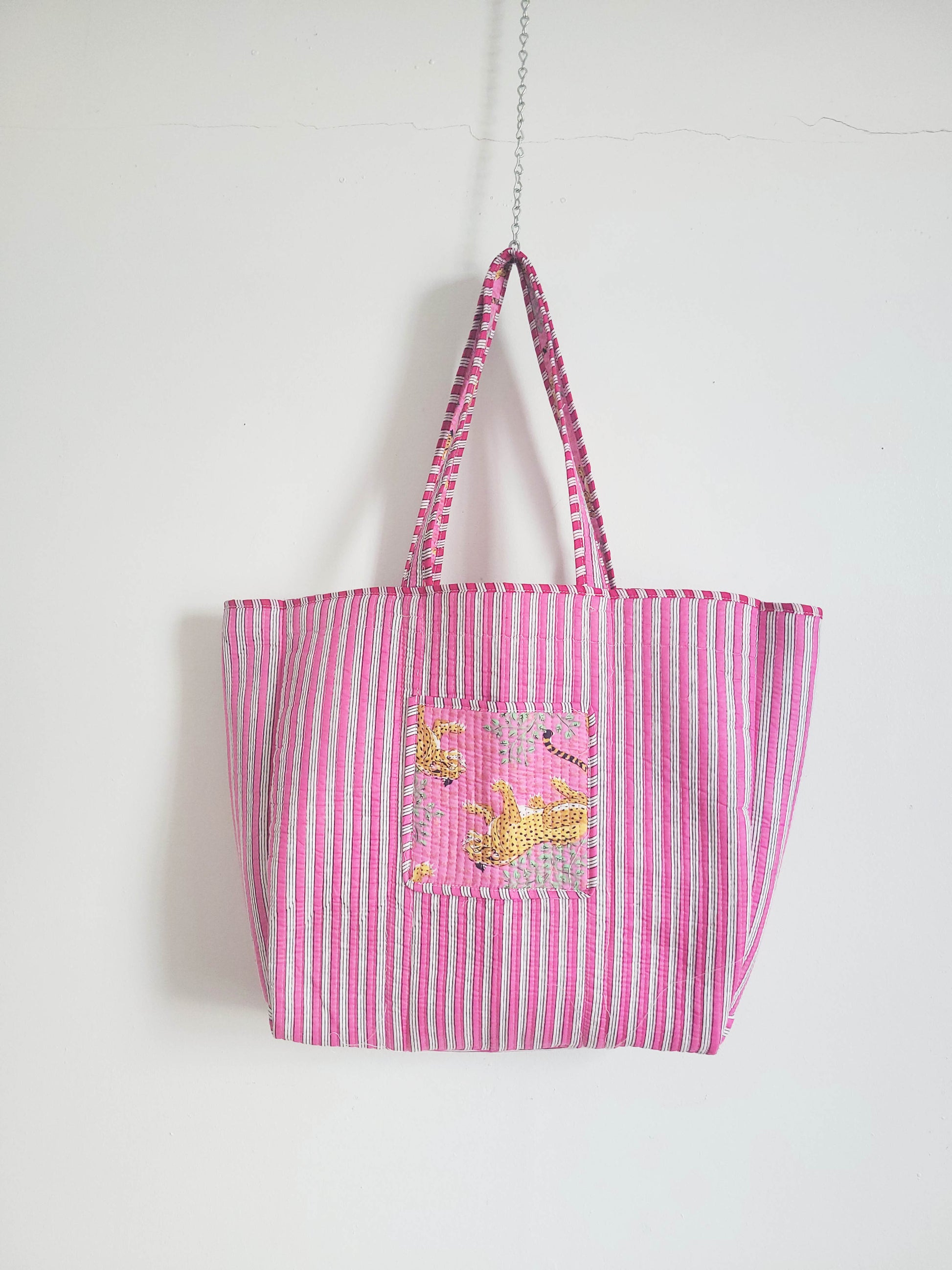 Black handmade quilted tote bag with top handles