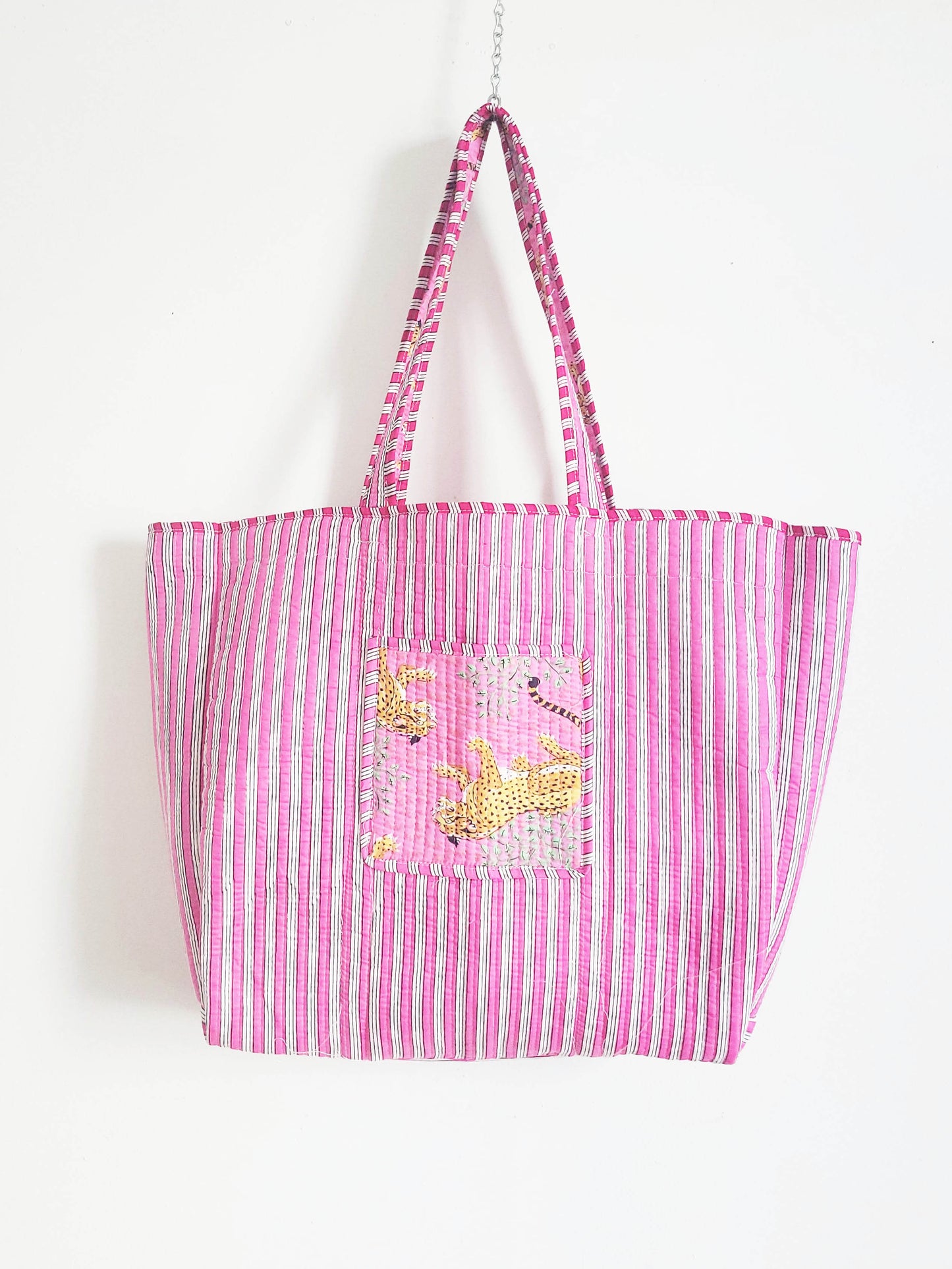 Flat-lay of accessories and clothing on table.