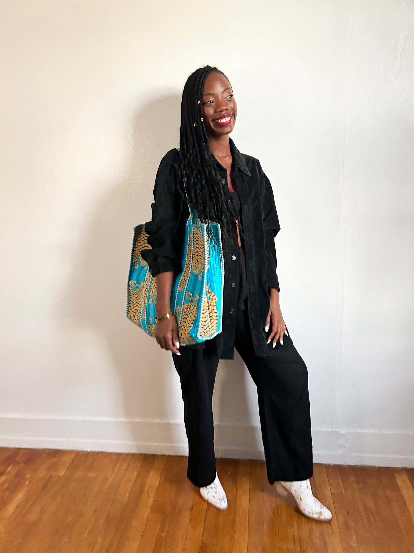 Flat-lay of accessories and clothing on table.