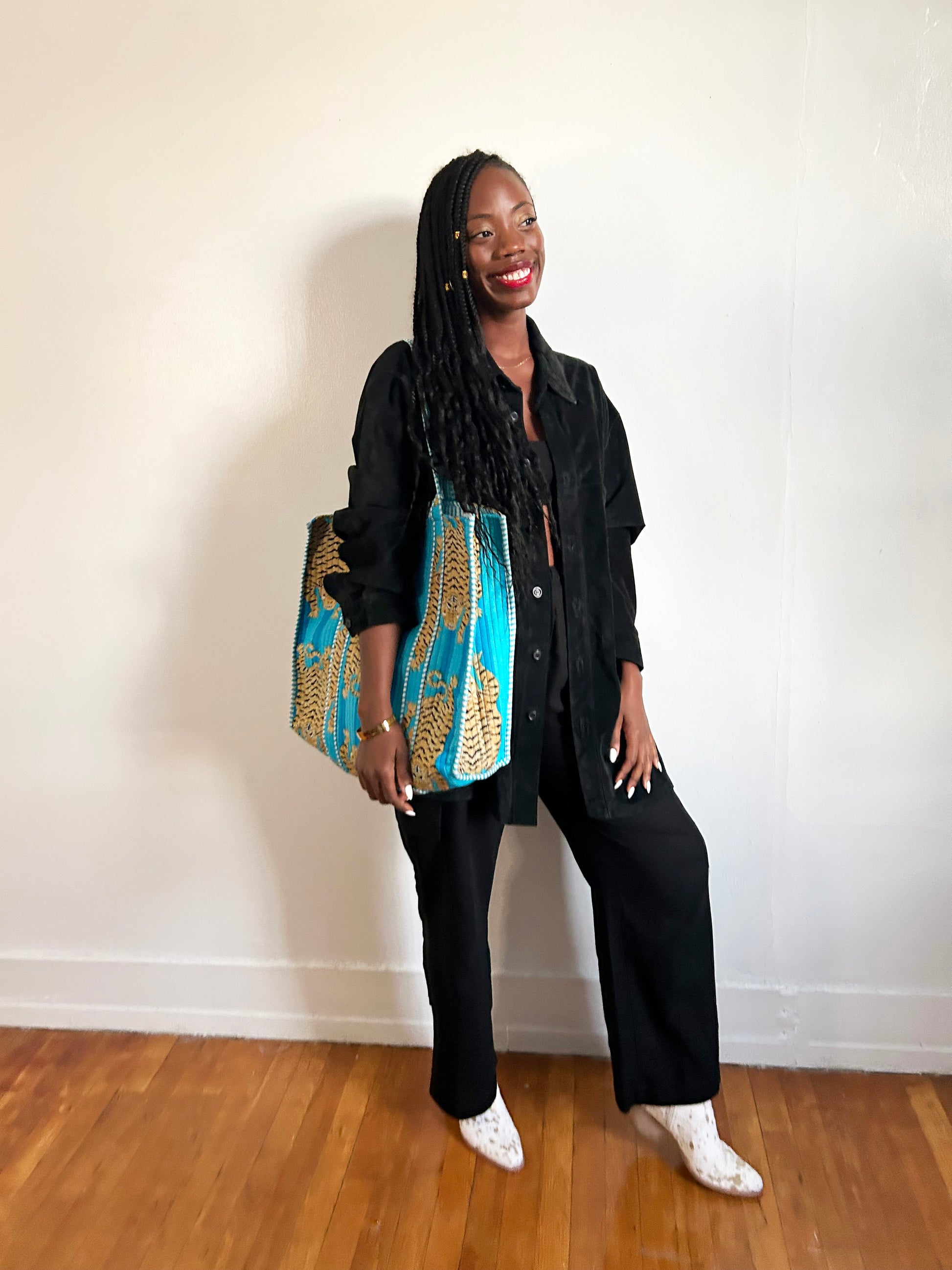 Flat-lay of accessories and clothing on table.