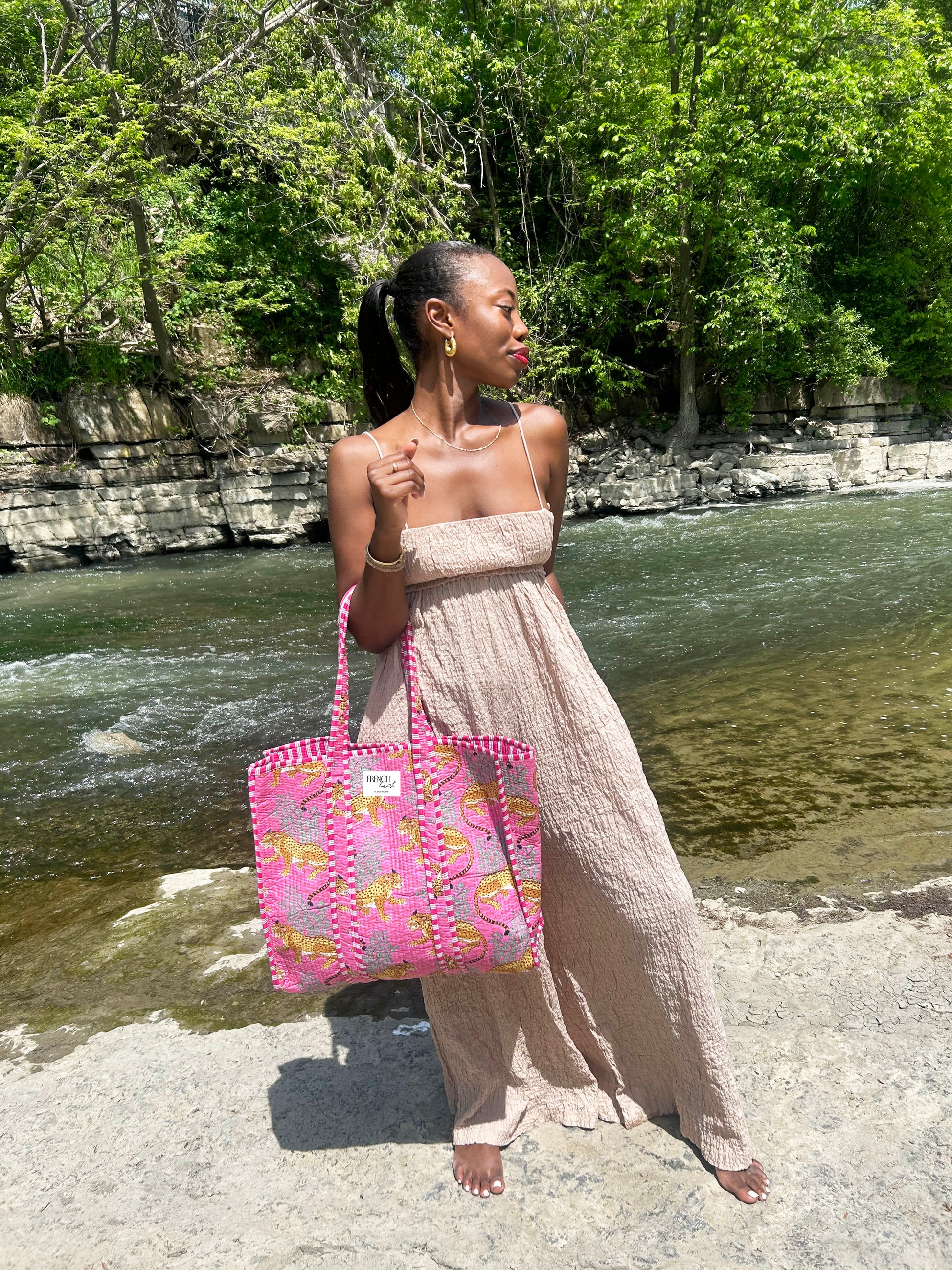 Model walking in casual fashion outdoors.
